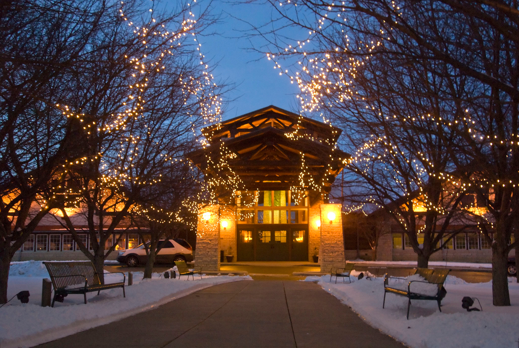 Lied Lodge exterior decoreated with holiday lights.