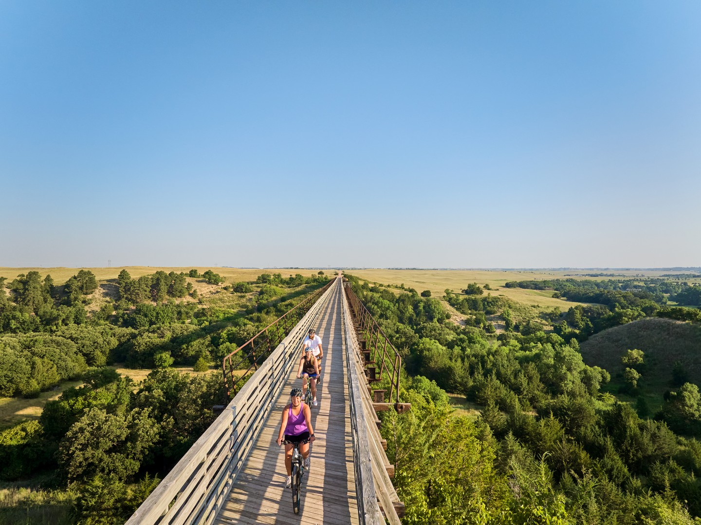 Bikers on the bridge of the Cowboy Trail.