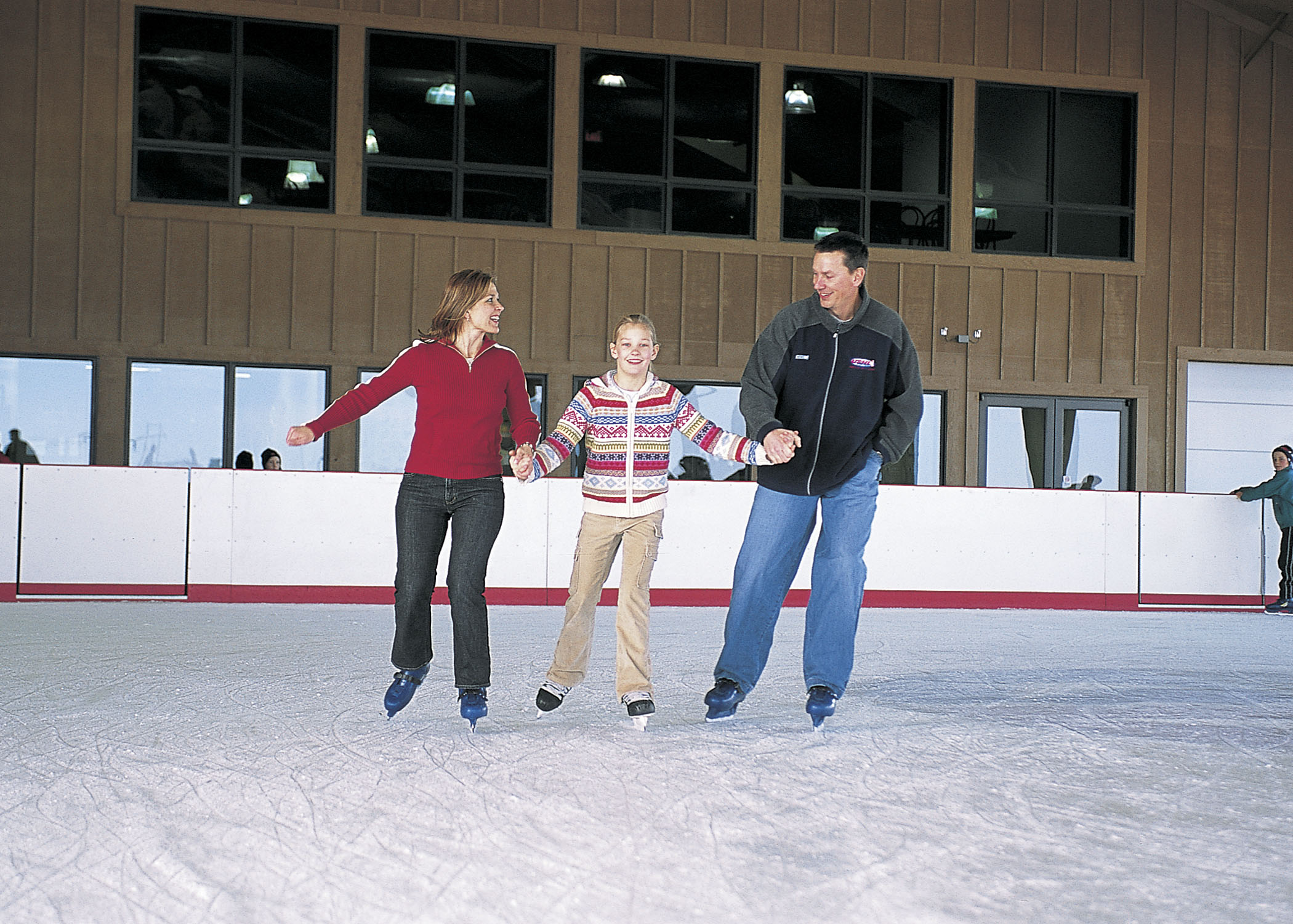 A family ice skates together at Mahoney State Park in Ashland, Nebraska