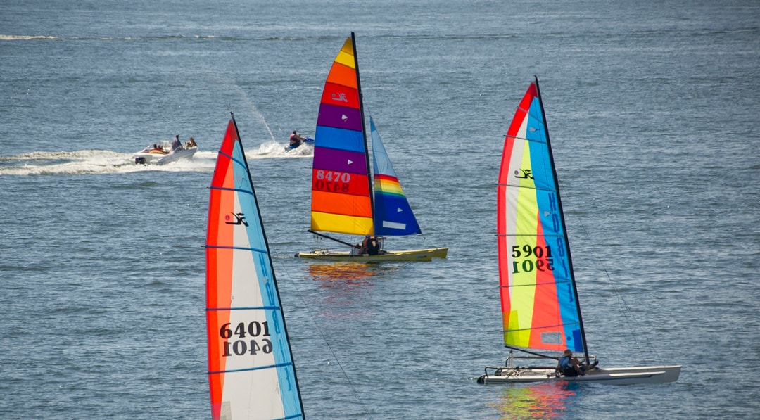 Sailboats, a speed boat and a jet ski explore the waters of Lake McConaughy near Ogallala, NE.