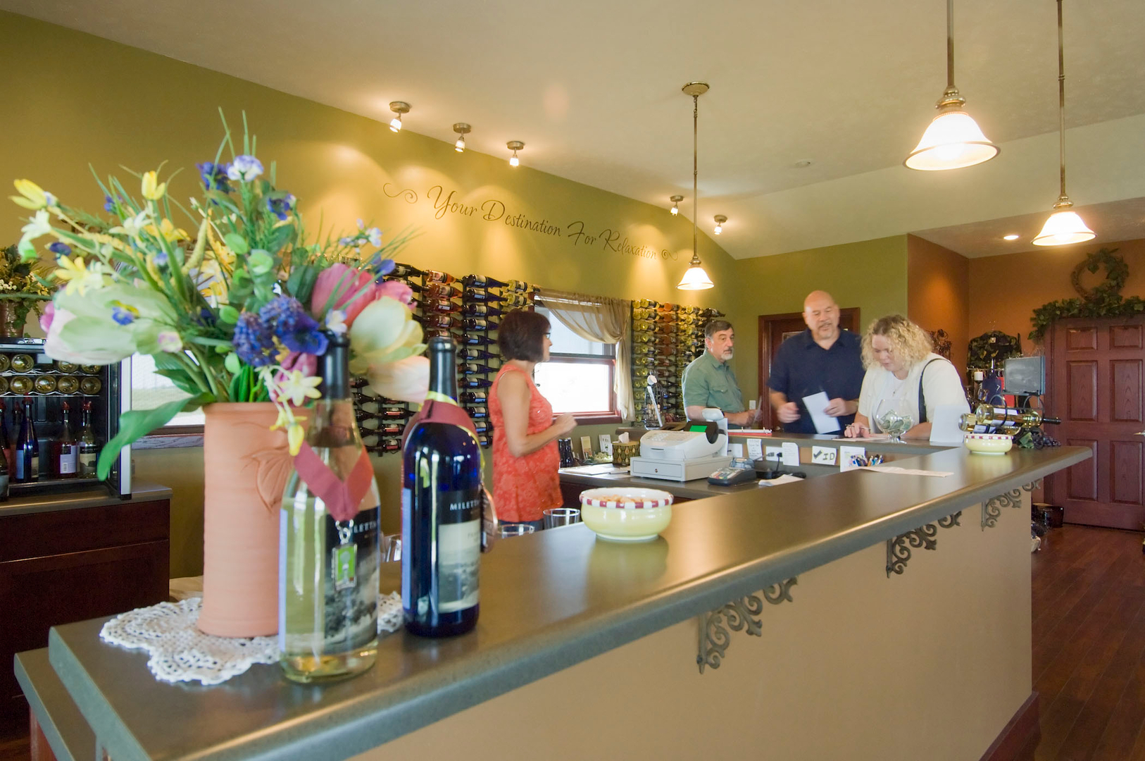 Inside photo of Miletta Vista Winery showing people testing the wine