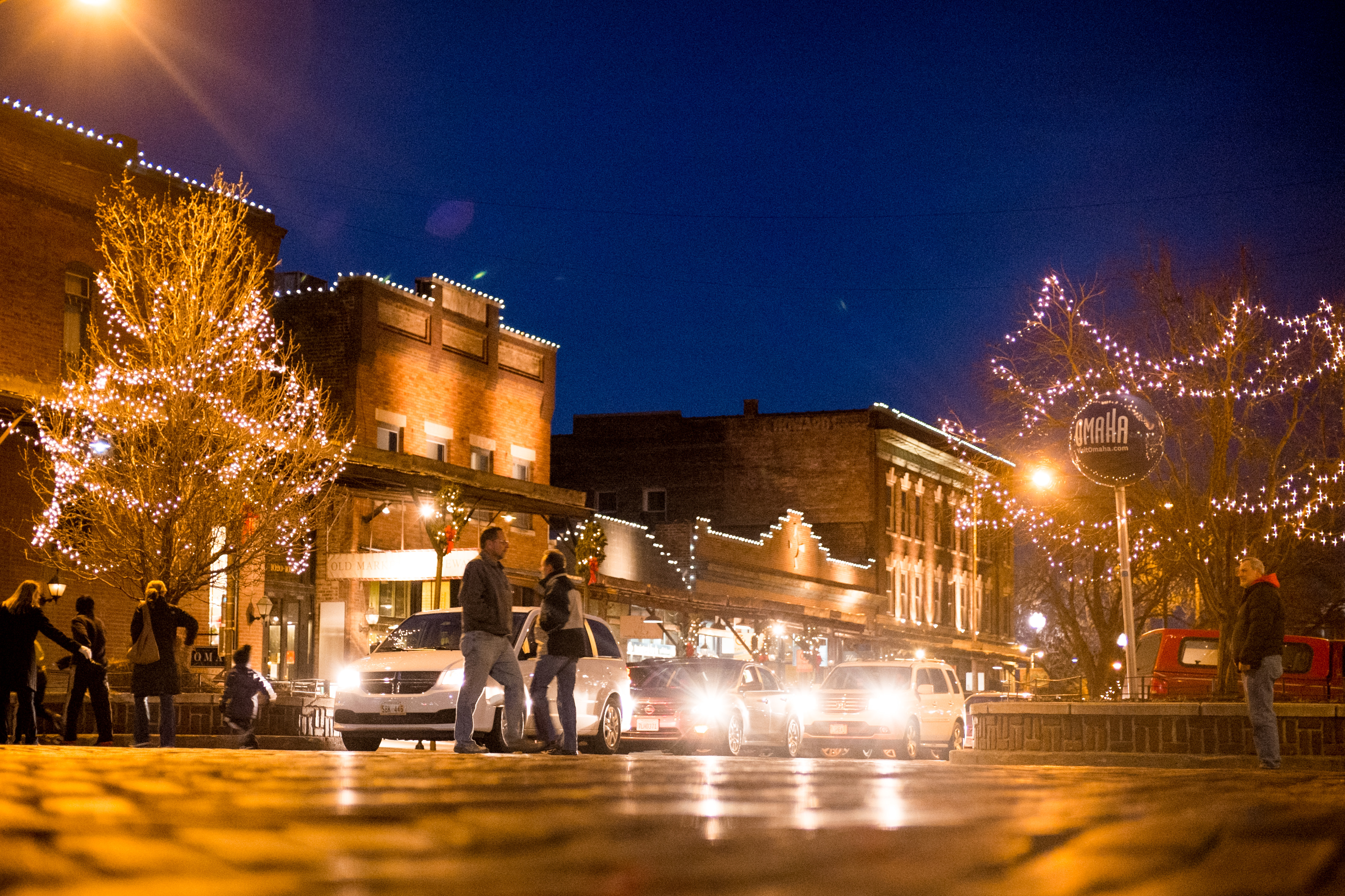 Old Market Omaha illuminated in white holiday lights.