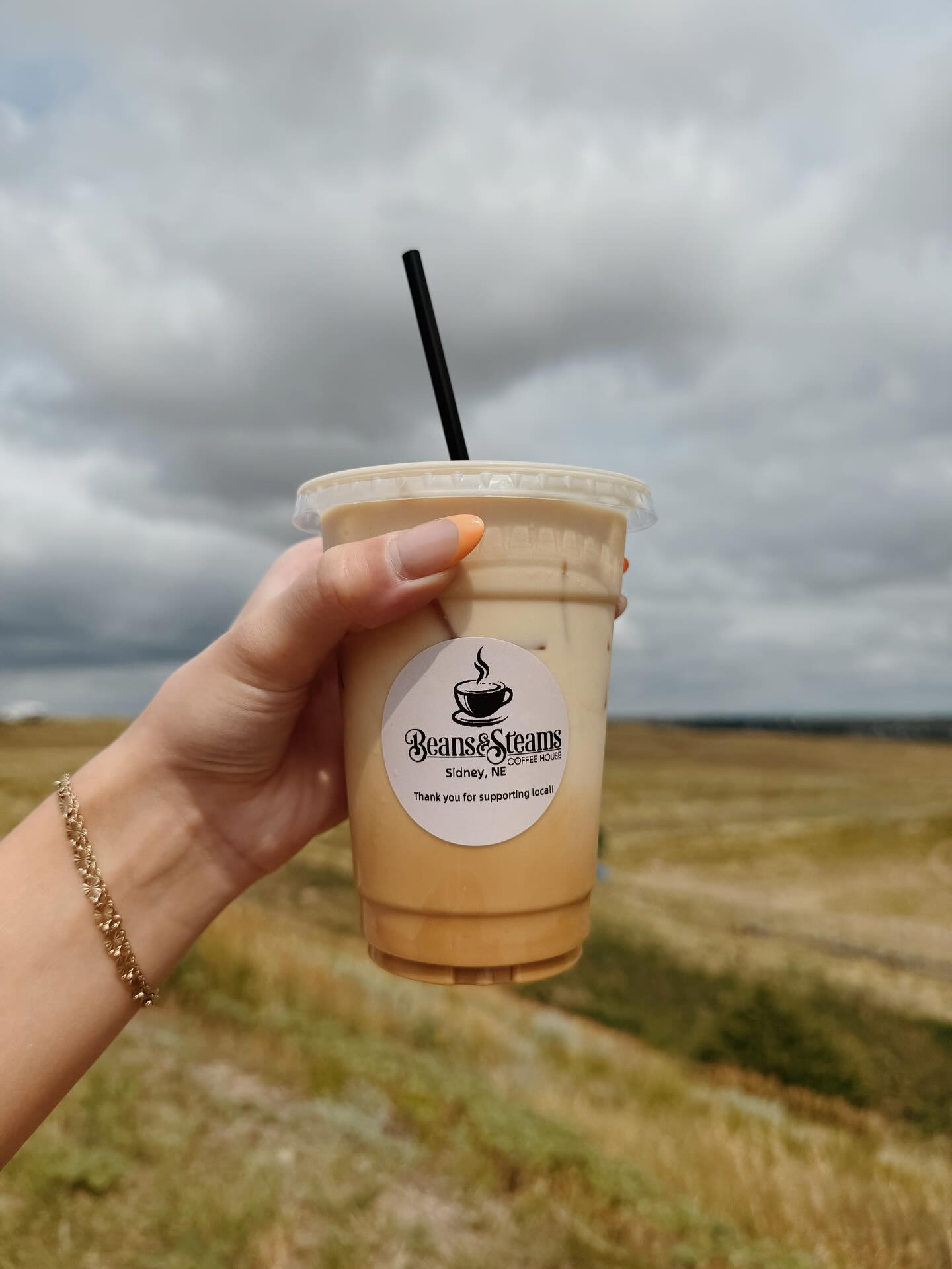 beans and steams coffee outdoors