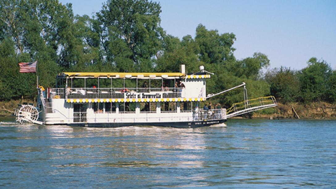 The Spirit of Brownville Riverboat cruises over the blue river waters near Brownsville, NE.