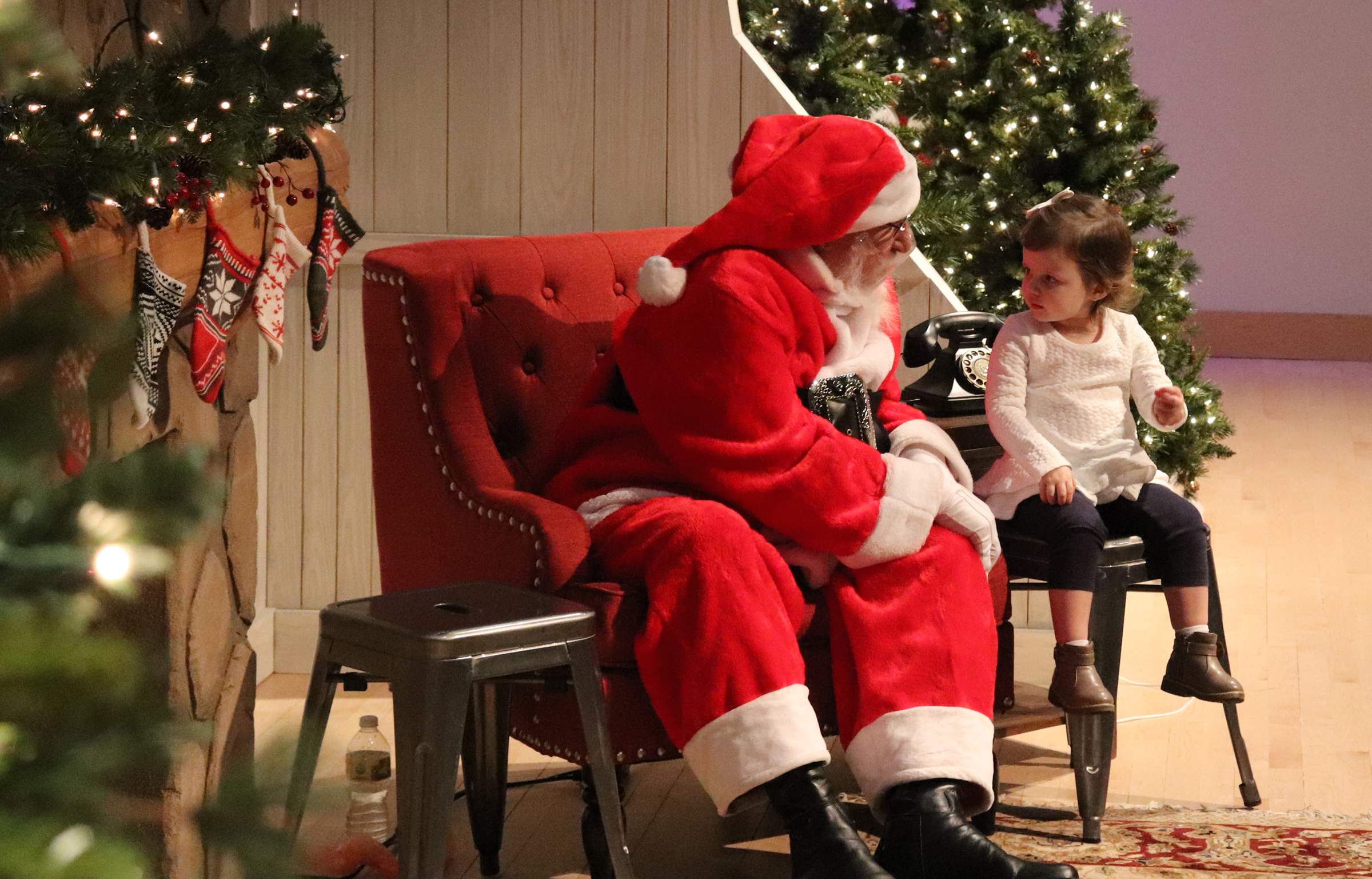 Santa and a child at The Durham Museum.