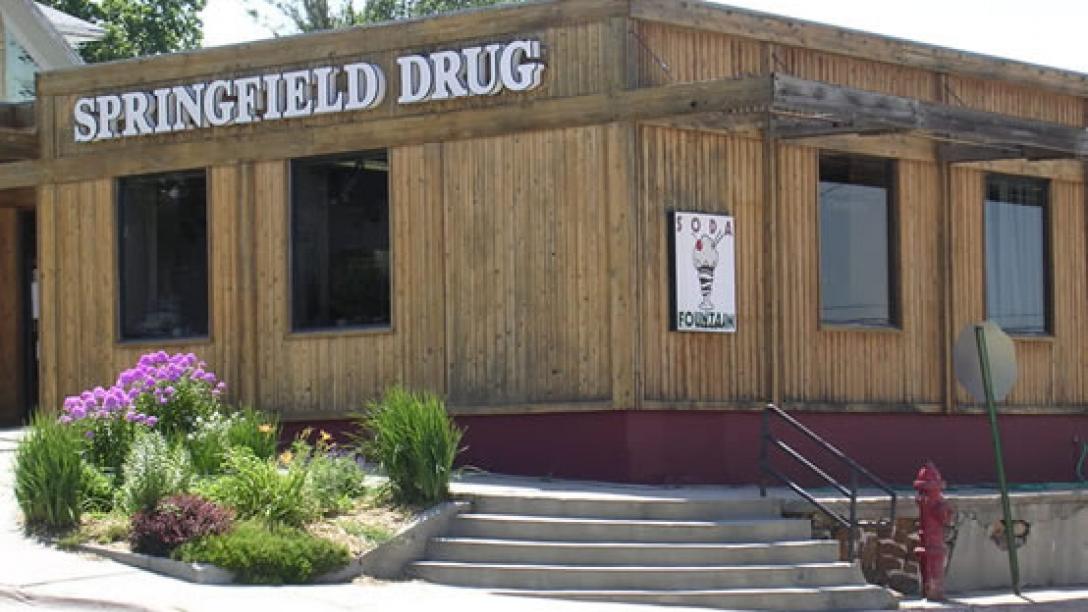 On a corner in Springfield, Nebraska, the wood-paneled Springfield Drug and Soda Fountain awaits hungry visitors.