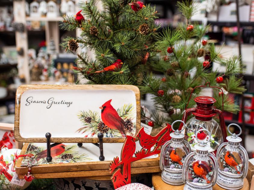 Holiday display in store with a Christmas tree and Cardinals surrounding.