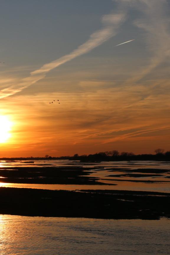 Rowe Sanctuary with the sun setting over the Platte River.