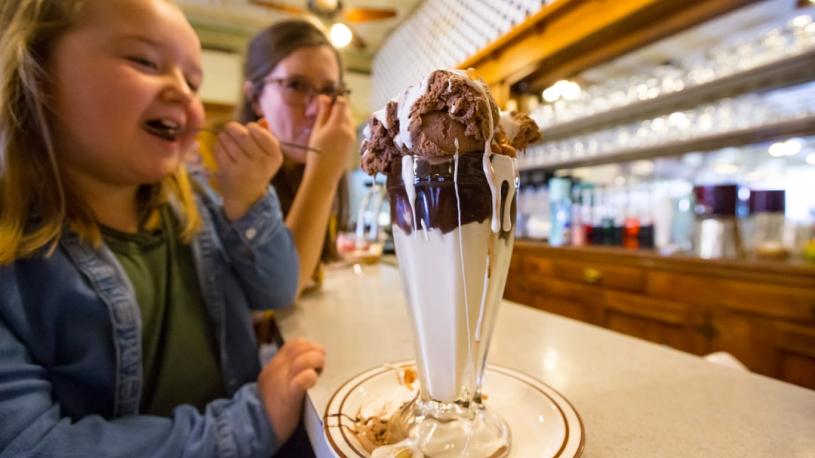 A mother and daughter enjoying a Tin Roof Sundae from Potter Sundry.