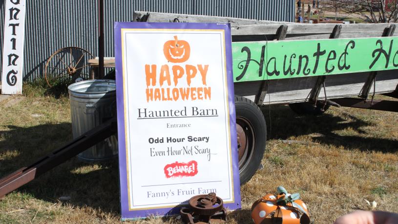 Haunted barn sign and displays at Fanny's Fruit Farm.