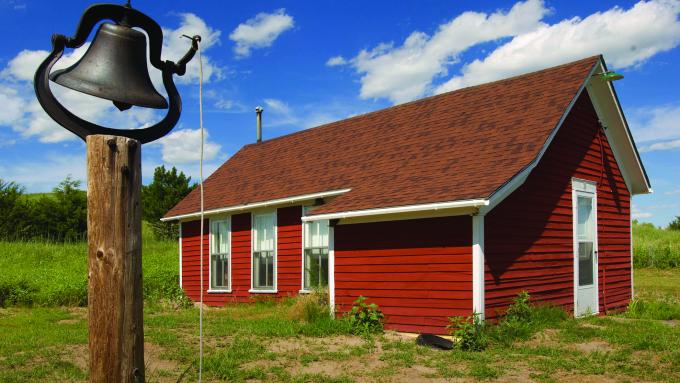 A bell stands ready to ring outside a building at Double R Guest Ranch near Mullen, NE.